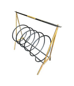 An unusual Italian 1950s mid century brass and black lacquered spiral magazine rack