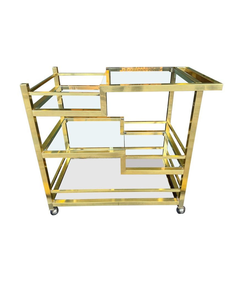 A 1970s Romeo Rega Italian bar trolley with multiple smoked glass shelves