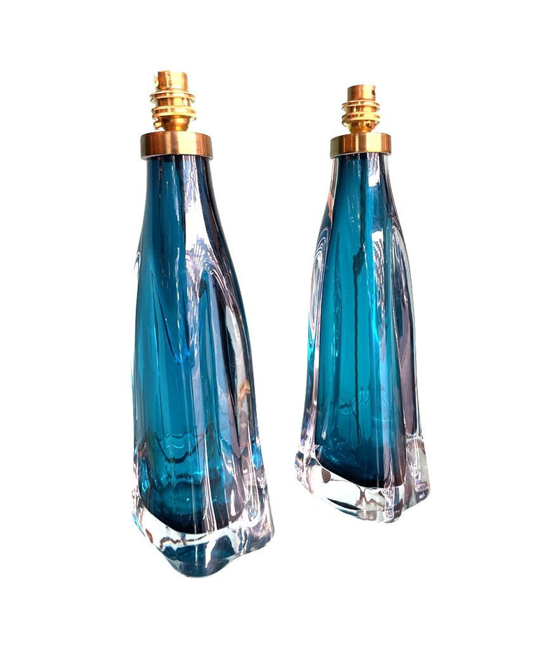 A pair of 1960s Orrefors turquoise glass and brass lamps with new bespoke linen shades