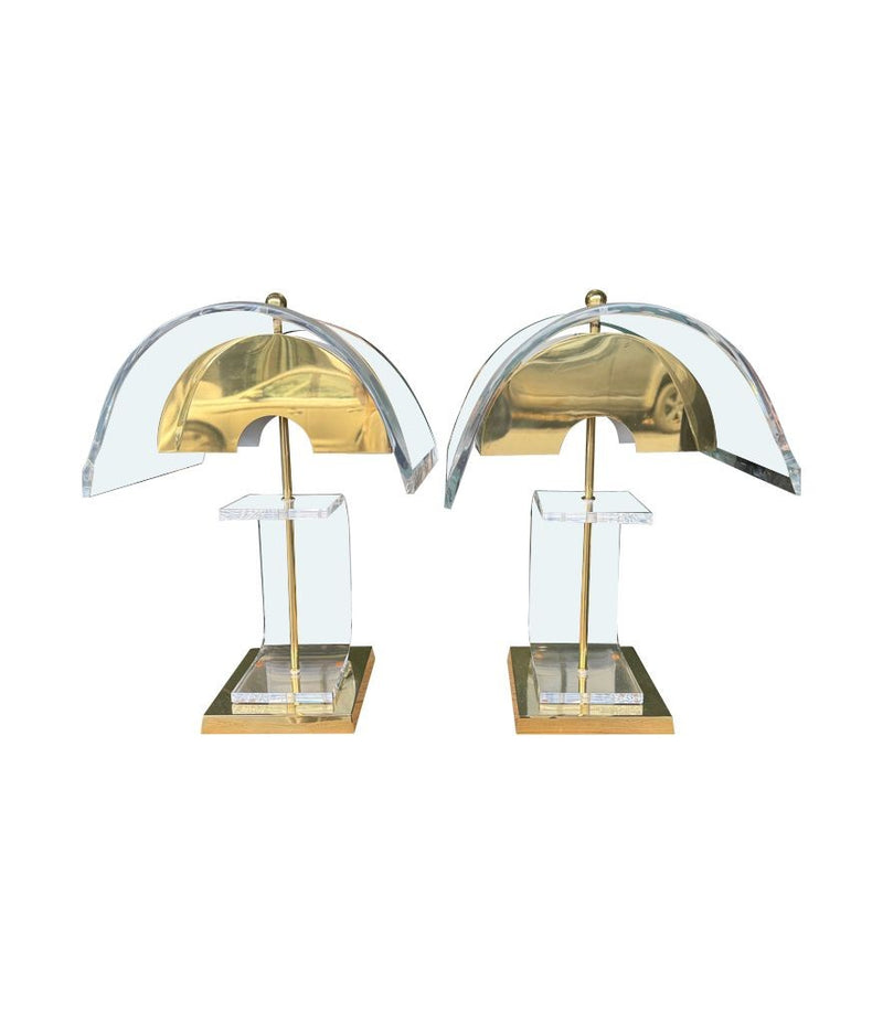 A large unusual pair of 1980s lucite and brass lamps with curved lucite shade and base