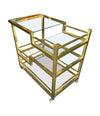 A 1970s Romeo Rega Italian bar trolley with multiple smoked glass shelves