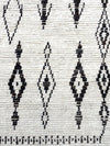 A vintage handwoven Moroccan berber rug, with tribal diamond and line pattern by the Beni Ouarian tribe