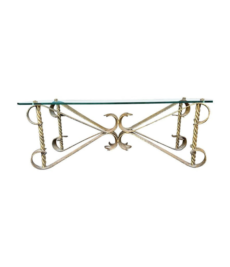 A Spanish 1950s gilt wrought iron coffee table with thick glass top