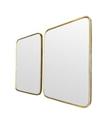 A lovely pair of 1950s Italian brass framed mirrors with solid wood backs