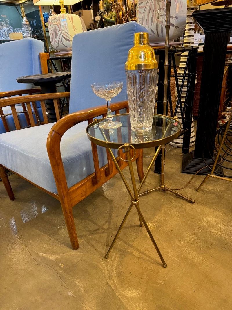 A lovely 1950s Fontana Arte style solid brass tripod martini table with thick glass top