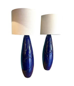 A pair of Italian 1980s large blue ceramic and brass lamps, rewired with with new fittings and linen shades