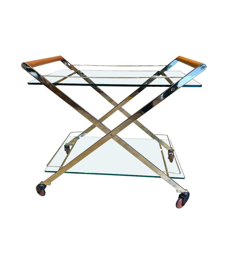 A 1980s Gallotti and Radice “Mister” bar trolley with brass frame and cherry wood handles.