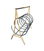 An unusual Italian 1950s mid century brass and black lacquered spiral magazine rack