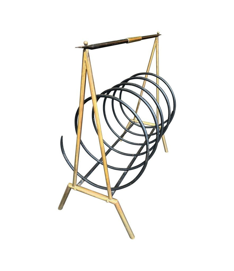 An unusual Italian 1950s mid century brass and black lacquered spiral magazine rack