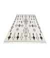 A vintage handwoven Moroccan berber rug, with tribal diamond and line pattern by the Beni Ouarian tribe