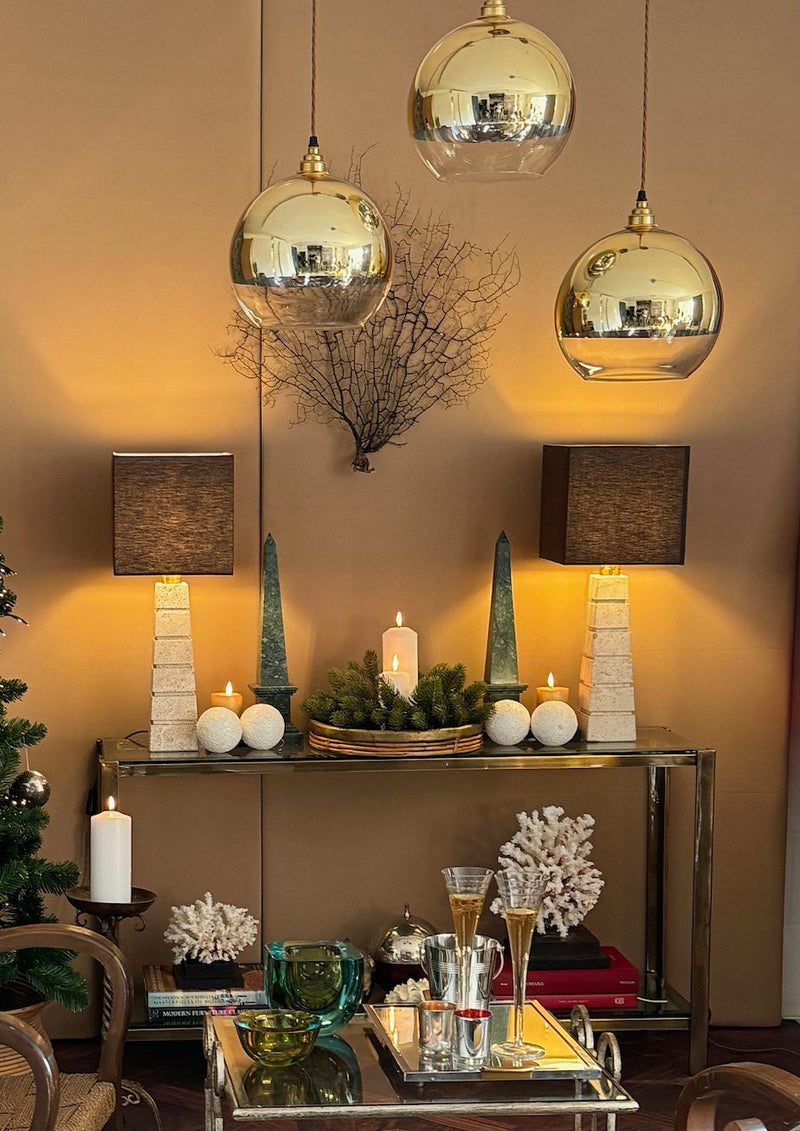 A 1970s Italian solid brass console table with 2 glass shelves