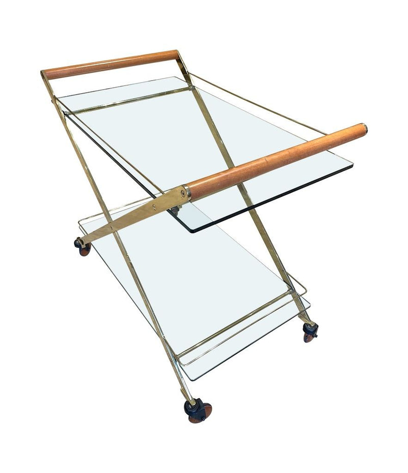 A 1980s Gallotti and Radice “Mister” bar trolley with brass frame and cherry wood handles.