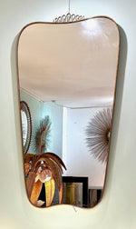 A lovely shaped large original 1950s brass framed mirror in the style of Gio Ponti