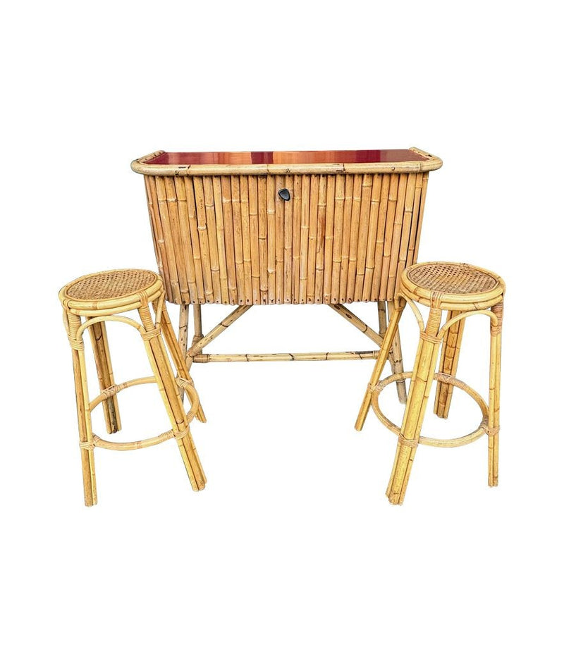 An Italian 1960s bamboo bar cabinet with red laminate top and two stools