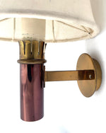 A rare pair of orignal 1960s copper and brass wall sconces by Stilnovo, with orignal labels