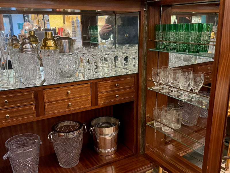 A wonderful 1950s two door bar cabinet by Poalo Buffa with faux malachite panels