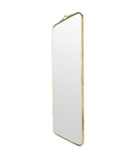 Mid century brass framed mirror with slim profile and scroll top detail