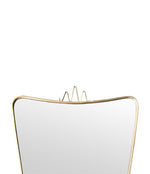 Mid century Italian brass shield mirror in the style of Gio Ponti