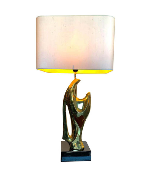 A 1970S SCULPTURAL LAMP IN THE STYLE OF ALAIN CHERVET WITH BLACK LACQUERED BASE